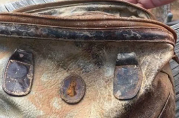 A boy frightened when he saw the inside of an old purse.